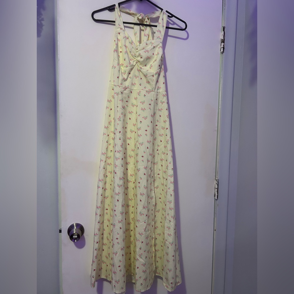 small yellow sundress covered in small flowers
